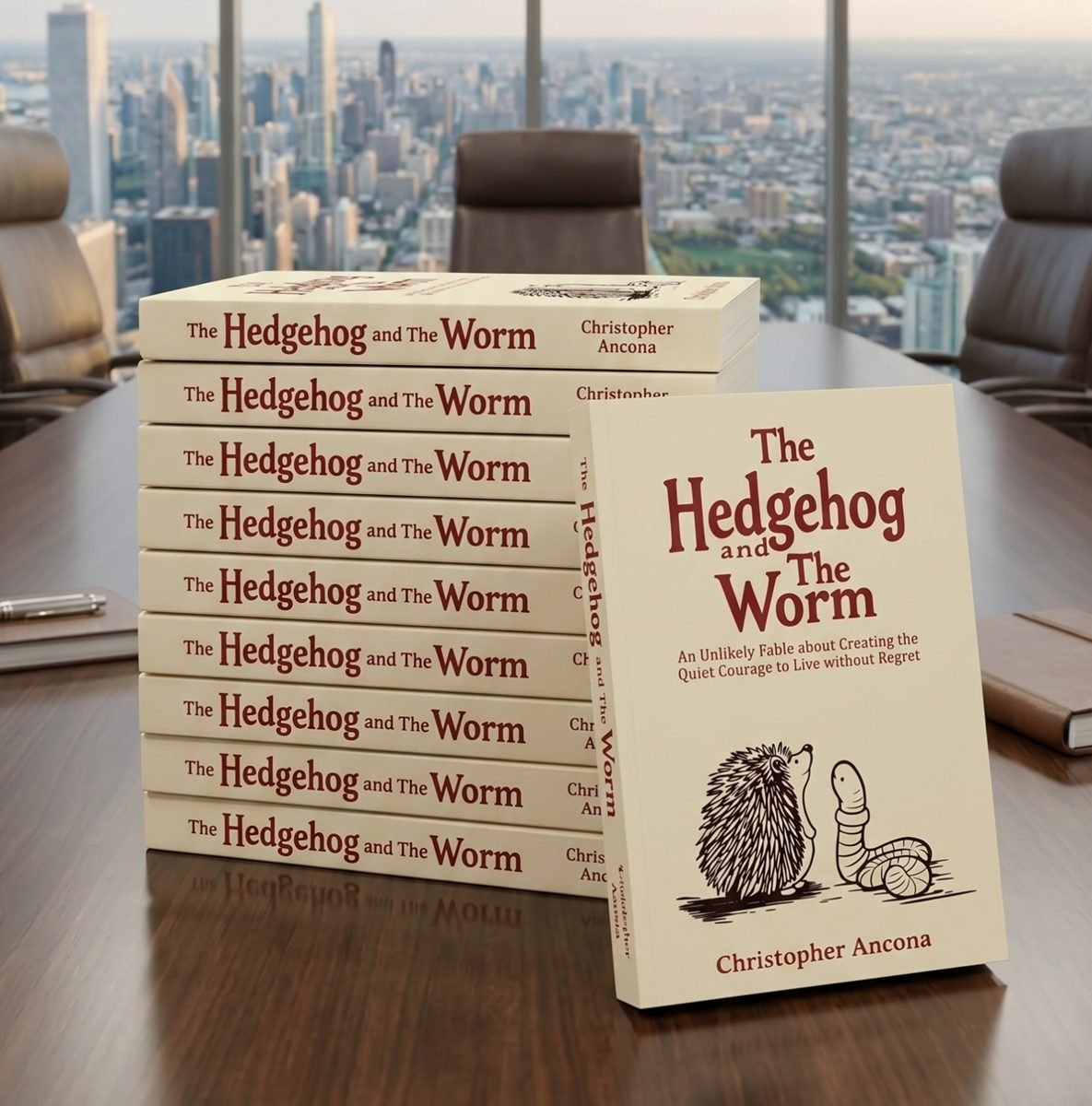 Ten copies of The Hedgehog and the Worm on a boardroom table